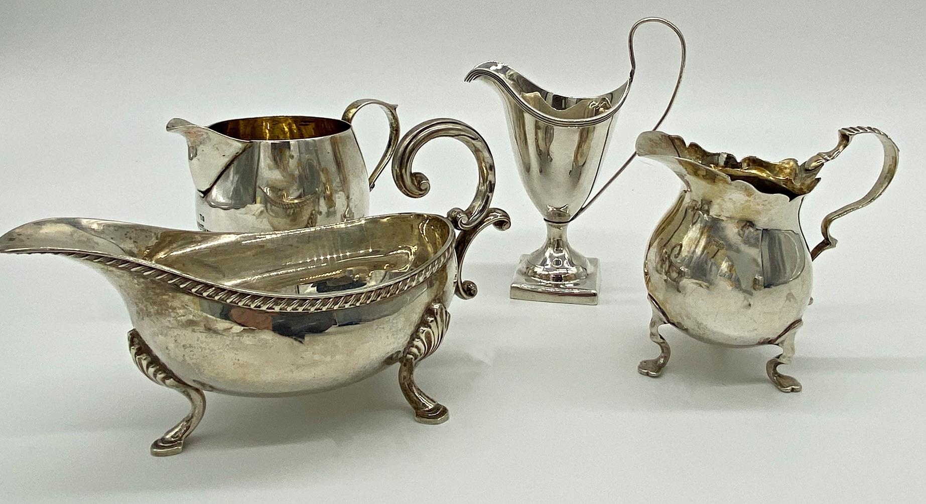 Four various silver jugs 11.5oz approx