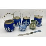 Four various Wedgwood jasperware biscuit barrels together with further jasperware bread knife, jug