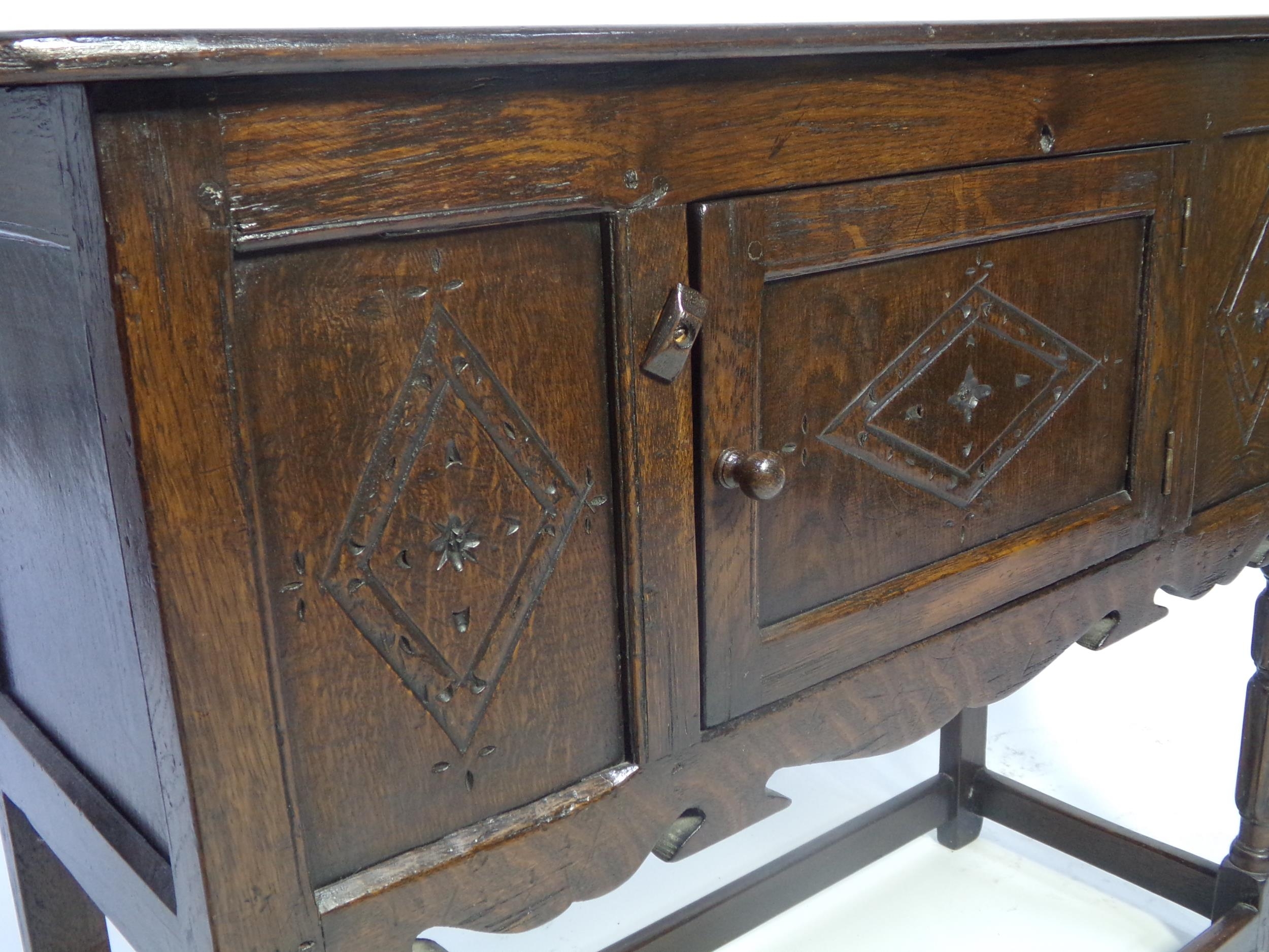 Jacobean style oak credence type cabinet, fitted with a panelled cupboard door, 74cm high x 91cm - Image 2 of 3