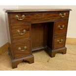 George III mahogany and flame mahogany cross banded knee hole desk, fitted with five drawers and