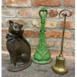 Three various iron door porters, one painted, one brass and one in the form of a seated cat (3)