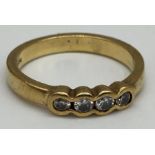 A 9ct gold ring set with white stones. Size O. Weight 3.4 grams approx.