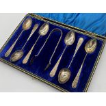 Late Victorian silver suite of six fancy teaspoons with sugar tongs, maker E & F, Birmingham 1895,