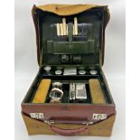 Good quality leather vanity case comprising various silver lidded jars and other tools, 32cm wide -