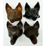 Set of four cast iron fox heads, possibly wall mounts, each 15cm high x 15cm deep (4)