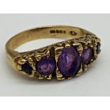 A 9ct gold gypsy ring set with 5 graduated Amethyst stones. Size H 3/4, weight 3.1 grams approx.