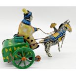 German tinplate windup toy of a clown on a horse drawn cart 19cm long