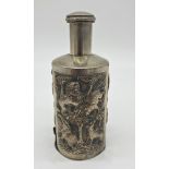 Indian white metal bottle sleeve, with screw top and hinged base, decorated with various wildlife,