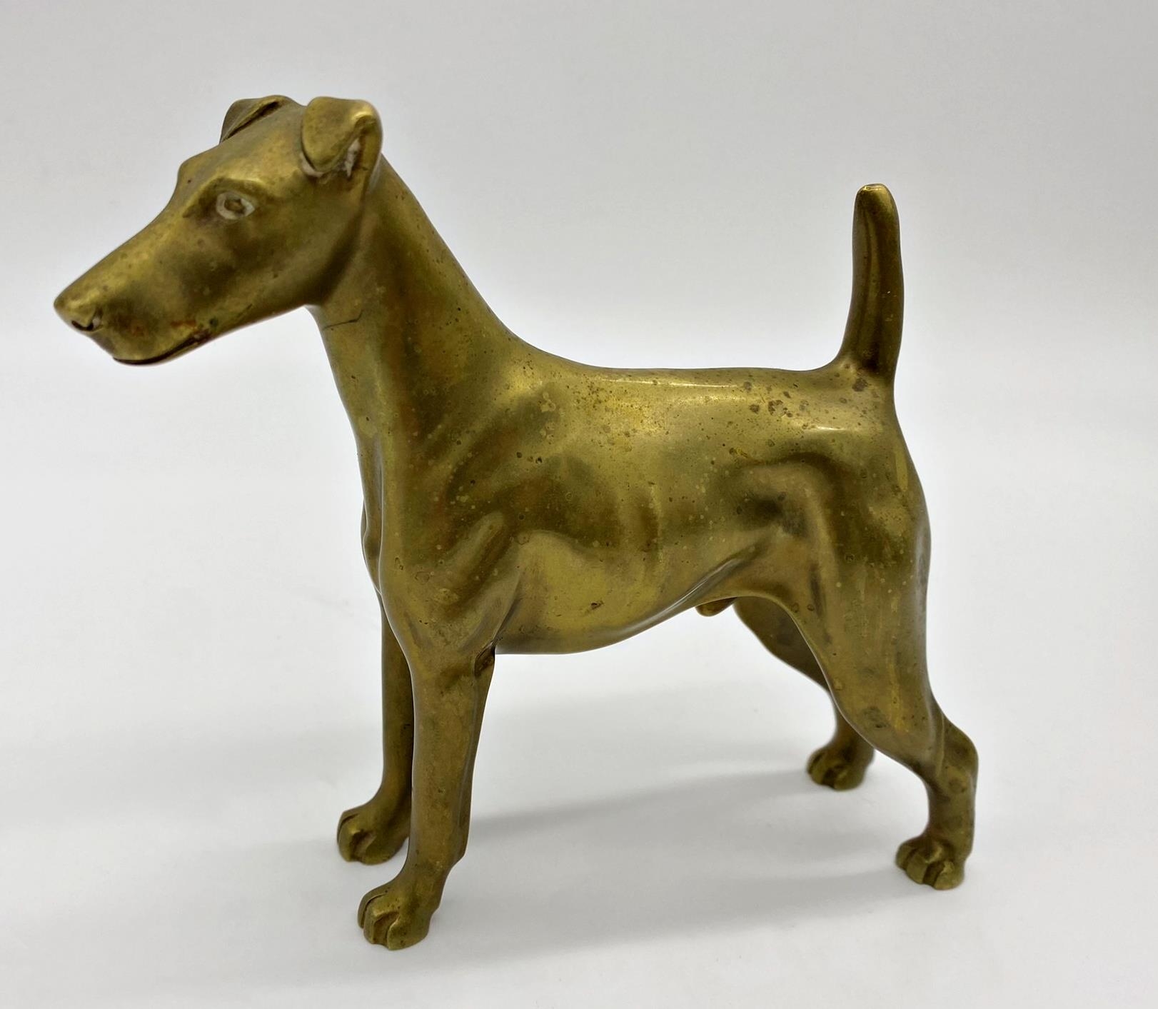 A cast metal possibly bronze study of a standing Irish terrier, 16cm long x 14cm high