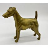 A cast metal possibly bronze study of a standing Irish terrier, 16cm long x 14cm high