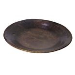 Early primitive treen charger or dish, 51cm diameter