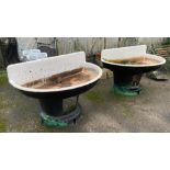 Quite remarkable pair of large enamelled feeders or troughs or sinks, d-end form on tapered bases,