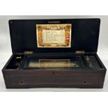 Late 19th century Swiss music box playing twelve airs, with inlaid top, 56cm long (not currently