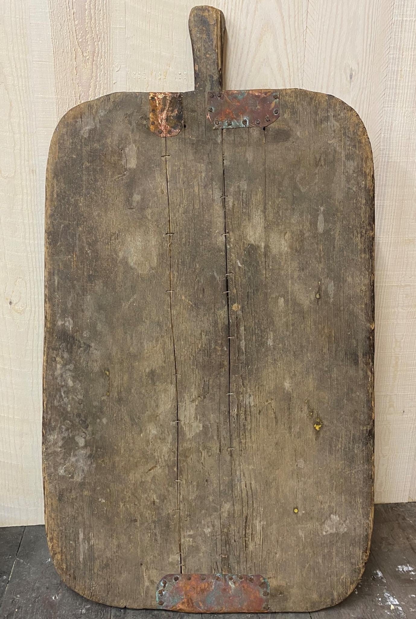 French provincial rustic bread board with studded zinc repairs, 91cm long