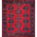 Turkish carpet, blue medallions on a red ground, 285 x 250, with four matching smaller modern rugs