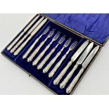 Cased silver handled fruit knife and fork canteen for six, hallmarks worn