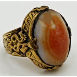 Possibly ancient yellow metal ring with a Celtic design shank and mount set with a polished agate