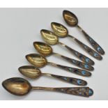 Suite of Russian silver gilt and enamel spoons, six teaspoons and lager spoon, 4oz approx