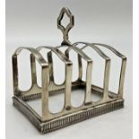 Good 1930s silver four divisional toast rack, serpentine brackets on a pierced and beaded base,
