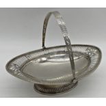 Edwardian silver basket, hinged handle and pierced rim, maker Martin Hall & co, Sheffield 1900, 28.