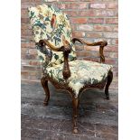 Good quality carver lounge chair, with tropical bird upholstery, the arms and framework carved