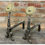 A pair of Arts & Crafts iron firedogs with novelty gilt sunflower knots, 47cm high x 36cm deep