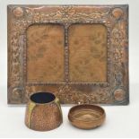 Arts & Crafts copper twin photograph frame with embossed swag decoration, monogrammed EL and dated