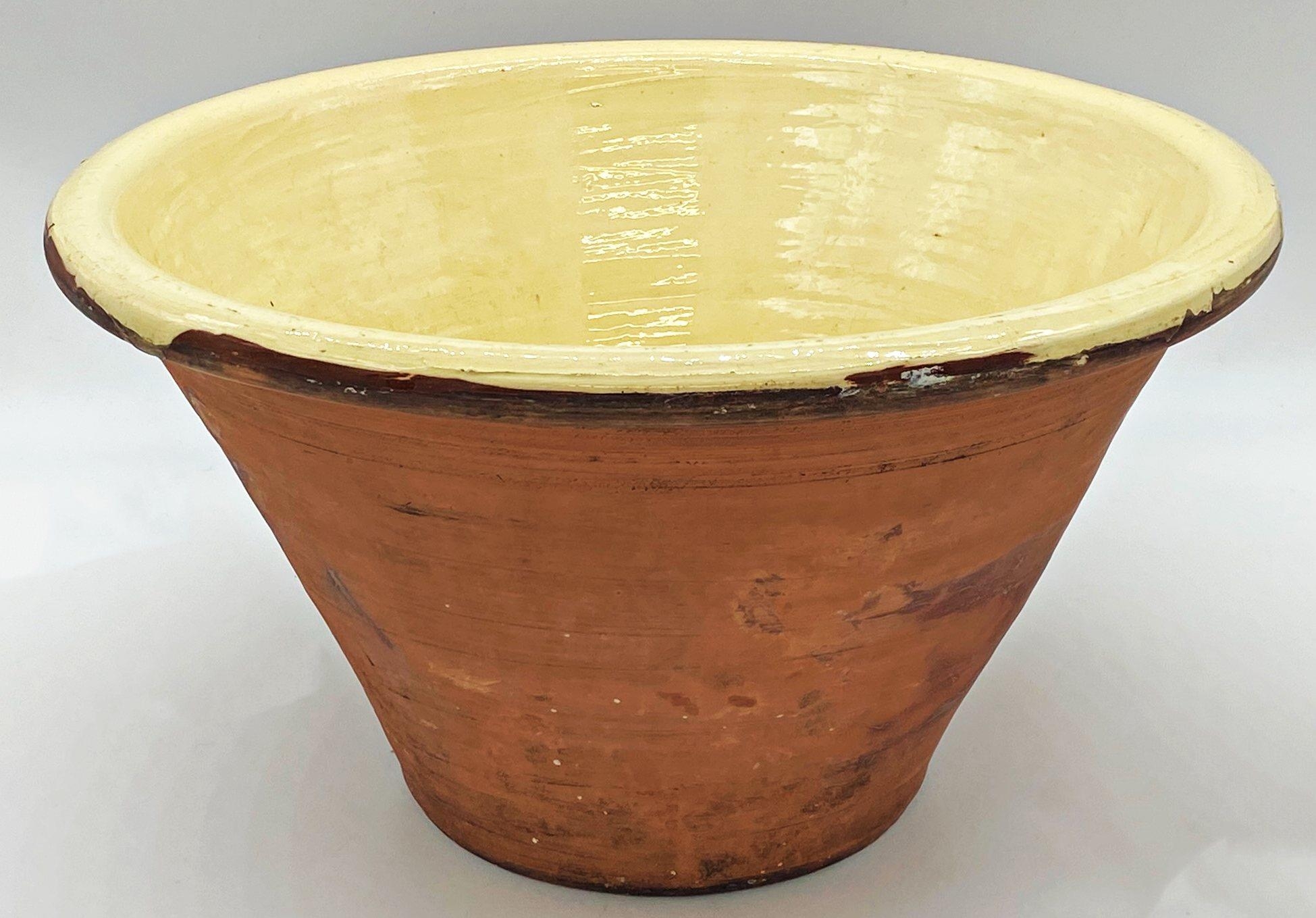 Good large antique terracotta dairy bowl with yellow glazed interior, 27cm high x 48cm diameter