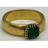 An 18ct gold ring set with a faceted green square stone. Size N 1/2, weight 6.5 grams approx.