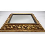 19th century gilt papier mache Medici mirror with original glass plate, 62 x 54cm