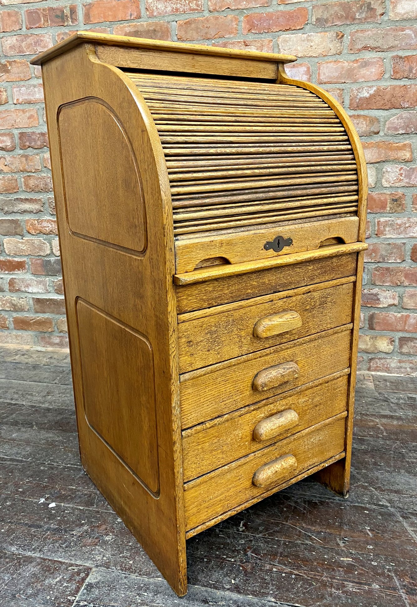 Sweet early 20th century golden oak students bureau, with tambour front, concealed work surface