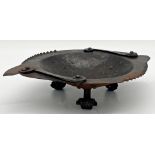 Unusual Arts & Crafts iron dish with applied scroll work and scrolled feet, 7.5cm high x 34cm long