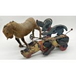 Vintage straw stuffed pull-along toy of a donkey, 32cm long (af) together with two wooden pull-along