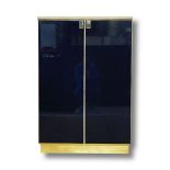 Lacquered and brass cabinet with travertine top attributed to Maison Jansen in good order, 133 cm