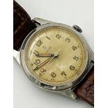 Vintage gents Tudor stainless steel wristwatch, 31mm case, lume hands and Arabic numerals, red arrow