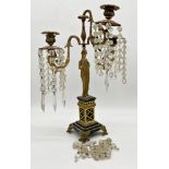 French Empire ormolu figural candlestick with three nautilus scrolled branches terminating in semi-