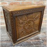 Unusual oak box, carved with various floral motifs with hinged mahogany lid and sectional