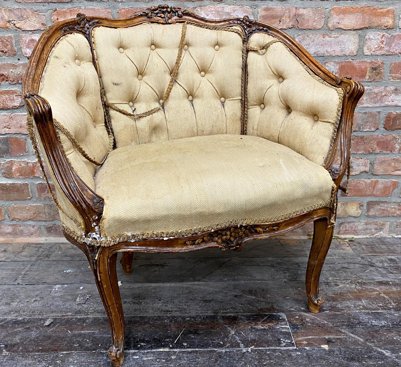 19th century French fauteuil salon chair with carved walnut framework, button back upholstery on