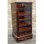 An early 20th century French rosewood bank of drawers or night cabinet with red veined marble top