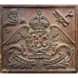 Good early Royal Flying Corps treen panel, carved with a plane and the bust of a pilot, 46 x 52cm