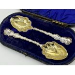 Case pair of quality Edwardian serving spoons, cast scrolled rims and gilt bowls, maker Lee &