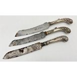 Pair of good quality white metal pistol grip handled carving knives, embossed with acanthus, 33cm