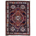 Intricate Persian Village rug, floral medallions, deep ground, 155 x 105cm