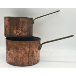 Two heavy hammered copper saucepans with cast brass handles, the largest 27cm diameter (2)