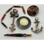 Four silver Scottish brooches and a silver part Scottish bracelet set with polished agate,
