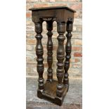 17th century and later square oak torchere, the moulded top on four ancient columns with an under-