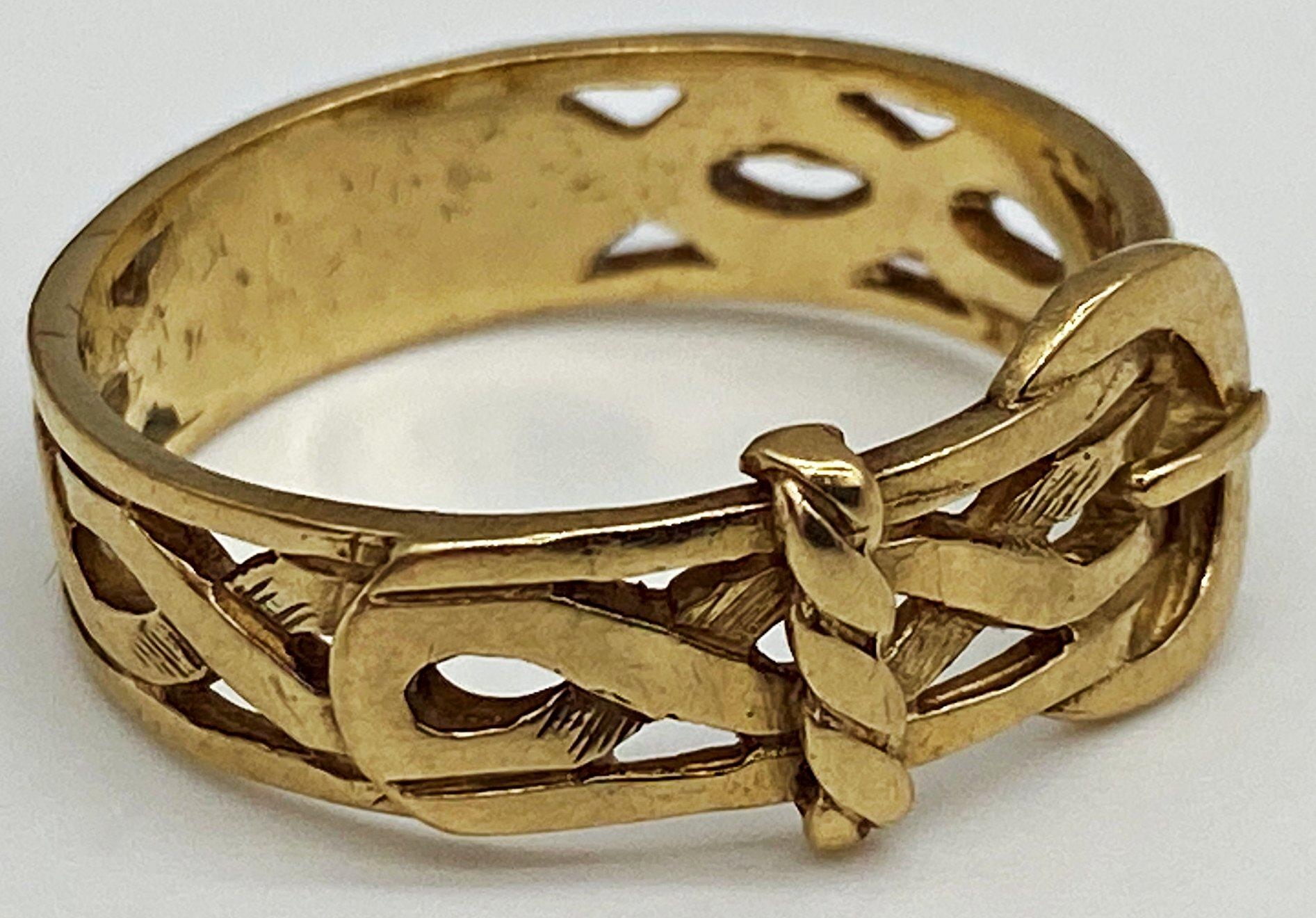 A 9ct gold Celtic design pierced work buckle ring stamped 375. Size S 1/2 weight 4.1 grams approx.