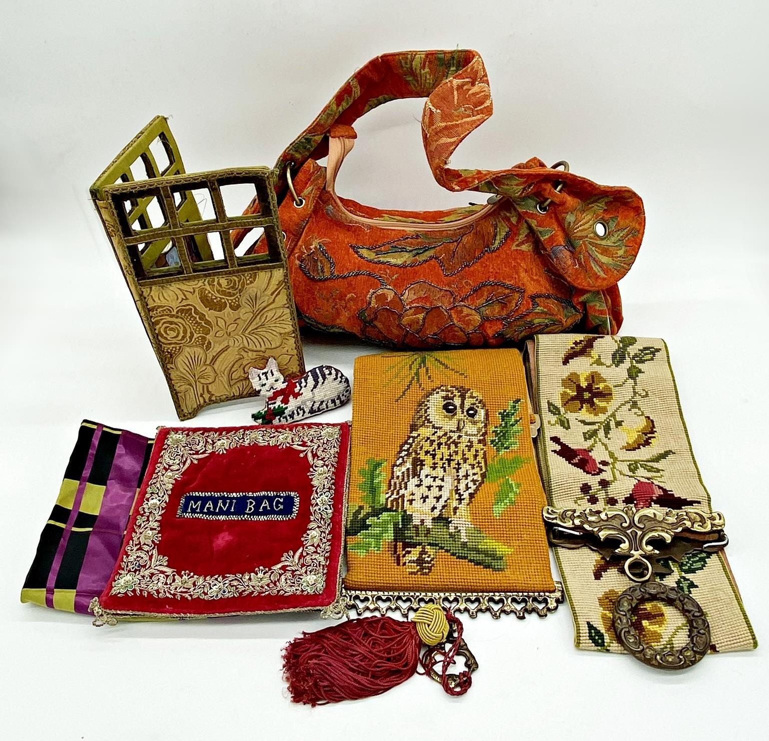 Two woolwork alter cloths, both weighted with brass, one decorated owls, 87cm long the other birds