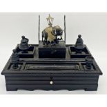 Impressive North-Indian ebony desk standish, mounted by an elephant in ceremonial dress with various