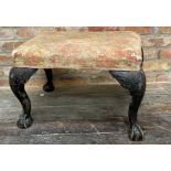 A period George III foot stool, stuffover seat on well carved cabriole legs terminating in claw